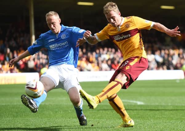Motherwell's Josh Law (right) battles with St Johnstone's Steven Anderson. Picture: SNS