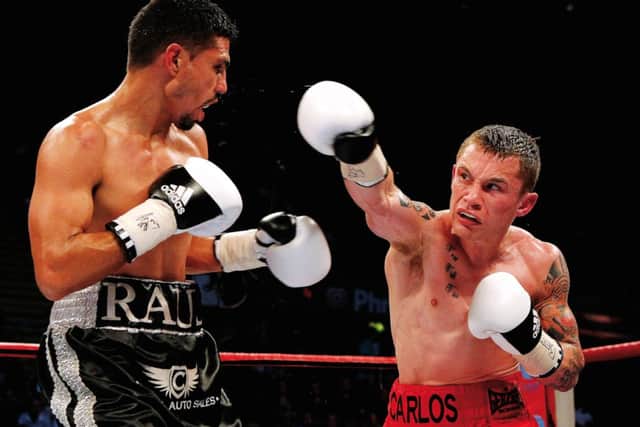 Carl Frampton, right, in action here with Raul Hirales, will fight Kiko Martinez in IBF Super-Bantamweight bout. Photograph: Scott Heavey