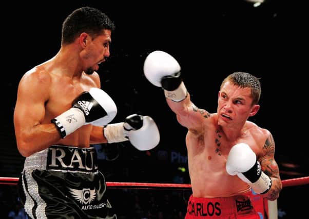 Carl Frampton, right, in action here with Raul Hirales, will fight Kiko Martinez in IBF Super-Bantamweight bout. Photograph: Scott Heavey