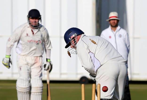 Scott McElnea bowls Stuart Corbett-Byres for the vital seventh wicket which won the championship for Ayr. Photograph: Robert Perry