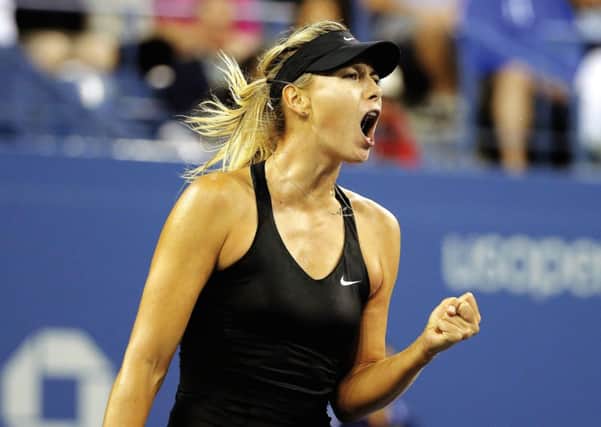 Maria Sharapova, of Russia, reacts after winning a game against Sabine Lisicki. Picture: AP