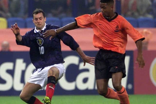 Patrick Kluivert, right, in his playing days fending off Scotland's Don Hutchison. Picture: AP