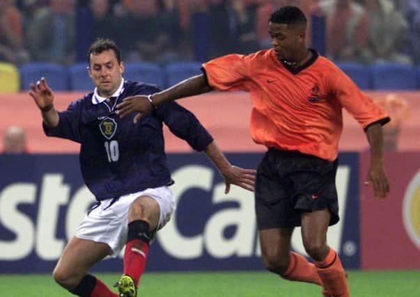 Patrick Kluivert, right, in his playing days fending off Scotland's Don Hutchison. Picture: AP