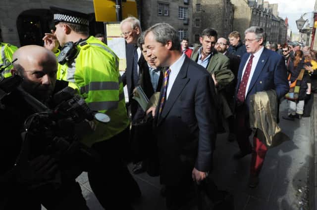 UKIP leader Nigel Farage is escorted by police during a previous visit to Edinburgh. Picture: Jane Barlow