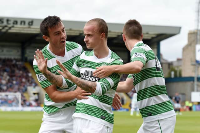 Leigh Griffiths (centre) celebrates after levelling the score. Picture: SNS