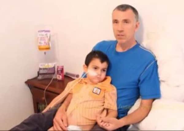 Five-year-old Ashya King with father Brett in a YouTube video before his parents were arrested