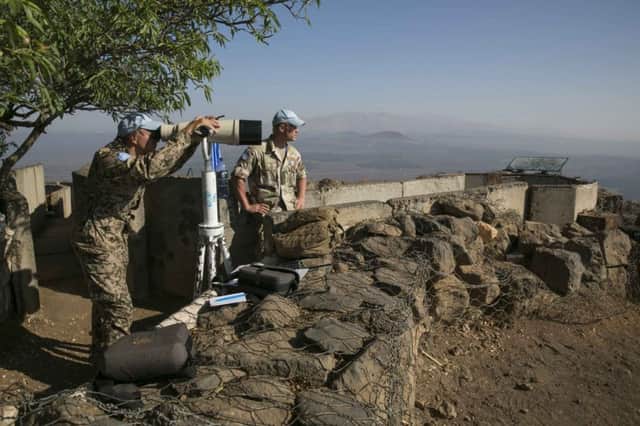 Part of the UN observer force on the Golan Heights; below, a Fijian peacekeeper. Picture: Reuters