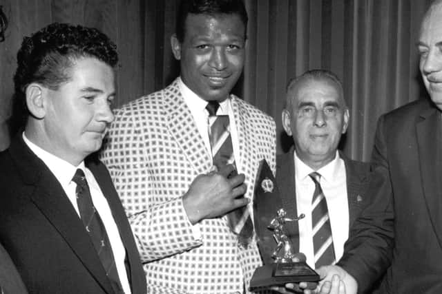 Sugar Ray Robinson is welcomed by Edinburgh City officials at the opening of their new social club in 1964. Picture: TSPL