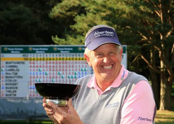 Colin Montgomerie with the trophy after successfully defending his Travis Perkins Masters title. Picture: Getty