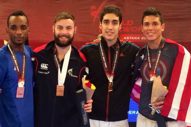 Damon Sansum, second from left, wins his first Grand Prix medal in Kazakhstan