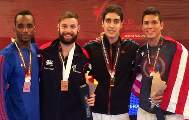 Damon Sansum, second from left, wins his first Grand Prix medal in Kazakhstan