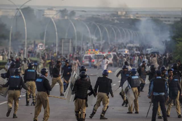 Antigovernment protesters clash with riot police in Islamabad. Picture: Reuters