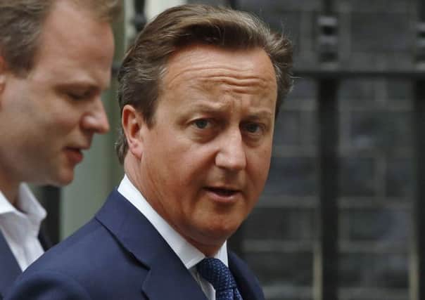 Cameron introduces new laws to stop radicalised Britons re-entering UK. Picture: Reuters