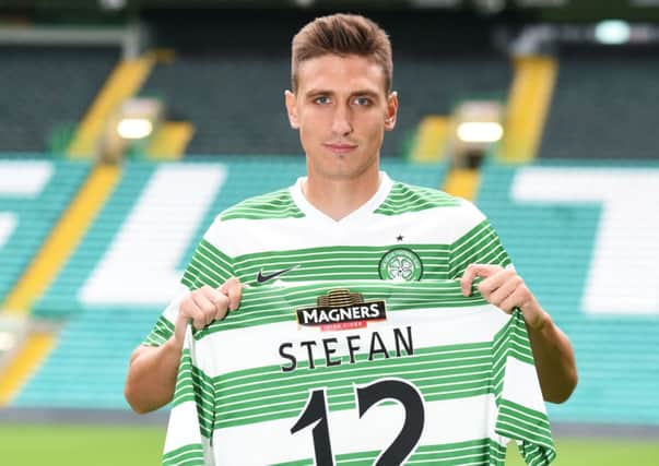 Stefan Scepovic shows off his number twelve shirt as he is unveiled as a Celtic player. Picture: SNS