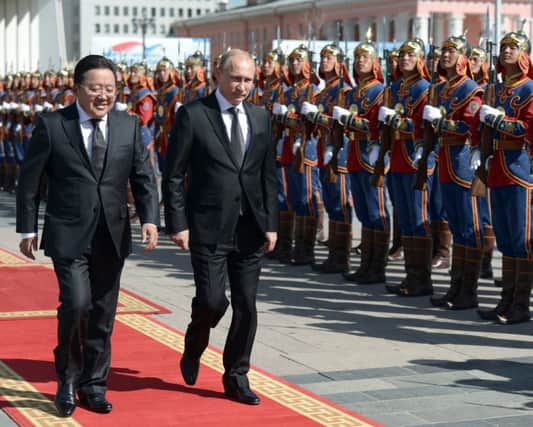 Elbegdorj Tsakhia, left, and Vladimir Putin in Genghis Khan Square. Picture: AP