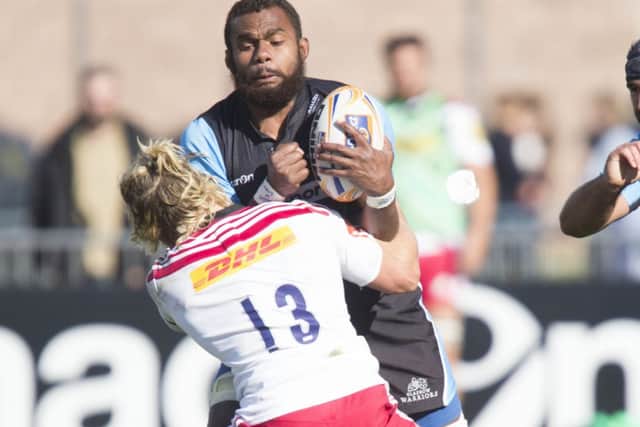 Glasgows Leone Nakawara is tackled by Harlequins Matt Hopper in preseason. Picture: SNS/SRU