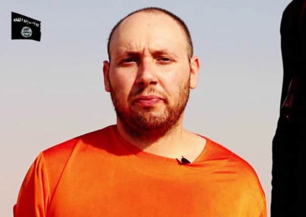 A still from the video released by IS showing Steven Sotloff moments before his murder. Picture: Reuters