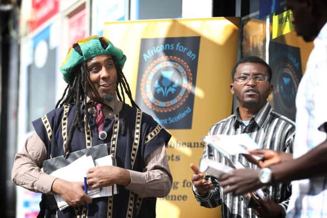 Graham Campbell and Chinaka Odum the teeasurer hand out leaflets outside the African Embassy in Duke street. Picture: 


Ian MacNicol