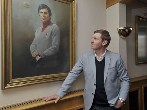 Stephen Gallacher looks at a painting of his uncle, Bernard Gallacher, in the Bathgate clubhouse. Picture: Ian Rutherford