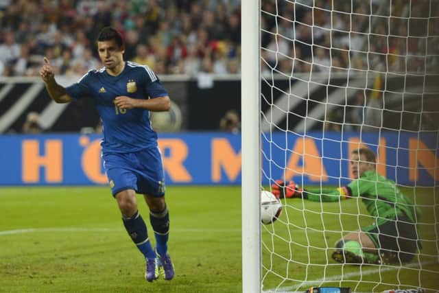 Sergio Aguero celebrates after scoring Argentinas opening goal. Picture: AP