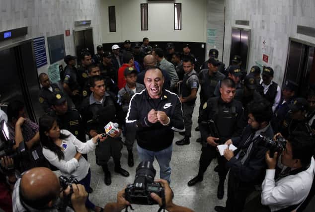 Byron Lima Oliva addresses the media before a hearing. Picture: Reuters