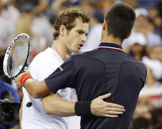Andy Murray, left, shakes hands with Novak Djokovic after losing in four sets. Picture: Reuters