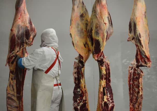 A worker at a Romanian abattoir found to be exporting horse meat last year. Picture: Getty