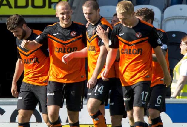 The boys were impressed with Dundee United's signings particularly Jaroslaw Fojut (2nd from right). Picture: SNS