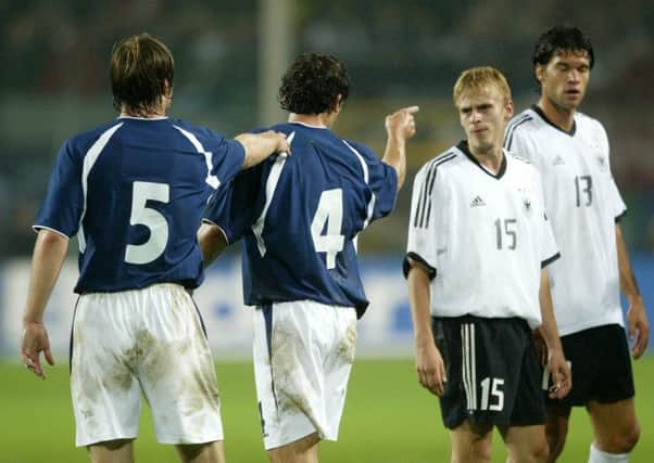 Scotland's Christian Dailly (2nd from left) points the finger at Tobias Rau during Germany's 2-1 victory in 2003. Picture: SNS