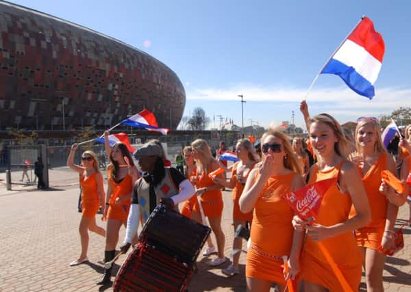 An ambush marketing stunt in which 36 women wore orange dresses to a World Cup match caused a social media surge. Picture:AFP/Getty