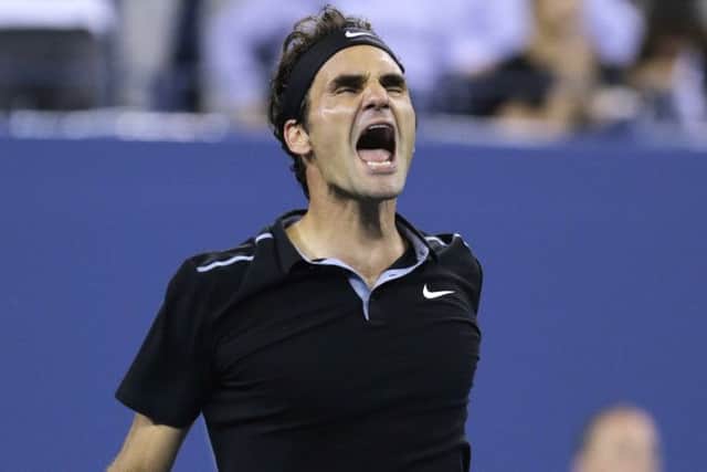 Roger Federer roars with delight after reaching the US Open semi-finals. Picture: AP