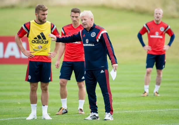 James Morrison, left, and Craig Bryson pay close attention to Gordon Strachan. Picture: SNS