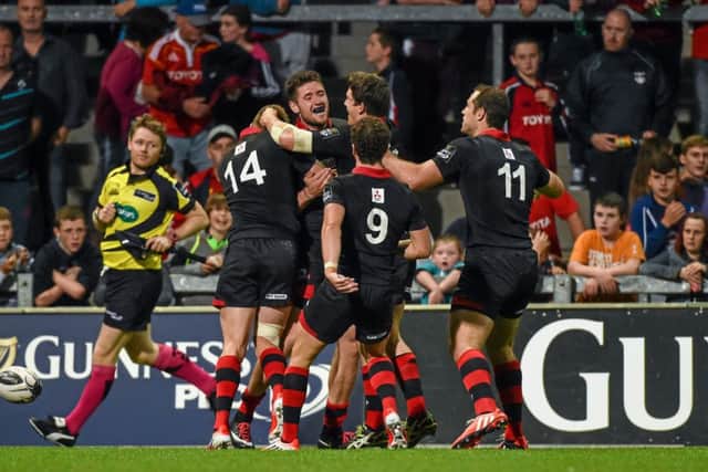 Jack Cuthbert, Edinburgh, is congratulated by team-mates. Picture: Diarmuid Greene
