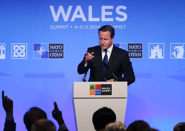 David Cameron talks to reporters at the NATO Summit on September 5, 2014 in Newport, Wales. Picture: Getty