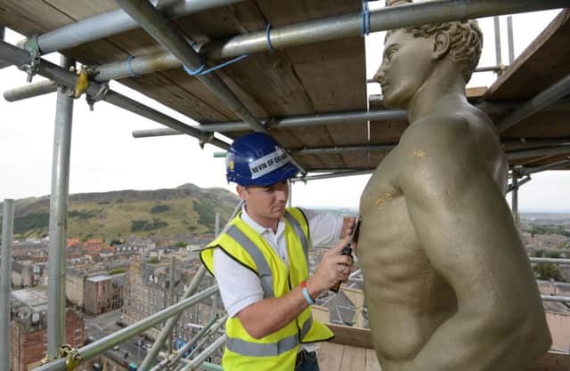 University of Edinburgh's golden boy statue. Picture: TSPL