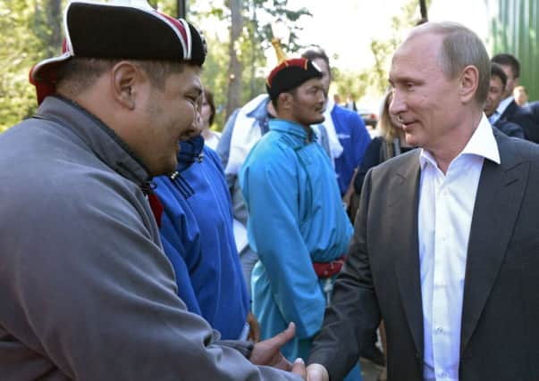 President Vladimir Putin meets participants marking the centenary of the Republic of Tyva joining Russia. Picture: Getty