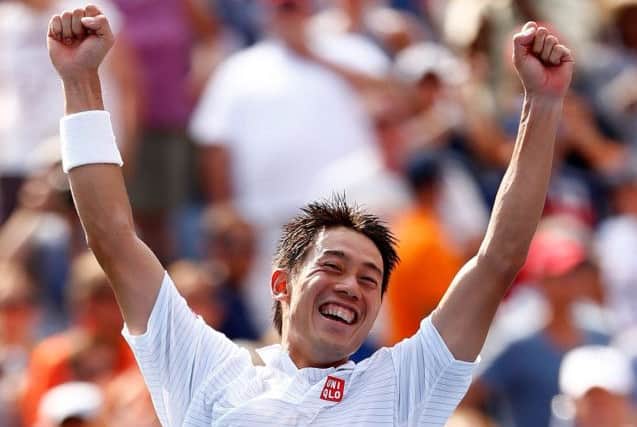 Kei Nishikori of Japan celebrates after defeating Novak Djokovic of Serbia in their men's singles semifinal match. Picture: Getty