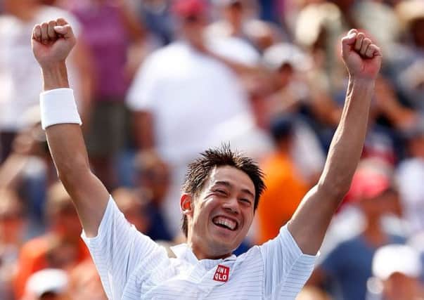 Kei Nishikori of Japan celebrates after defeating Novak Djokovic of Serbia in their men's singles semifinal match. Picture: Getty