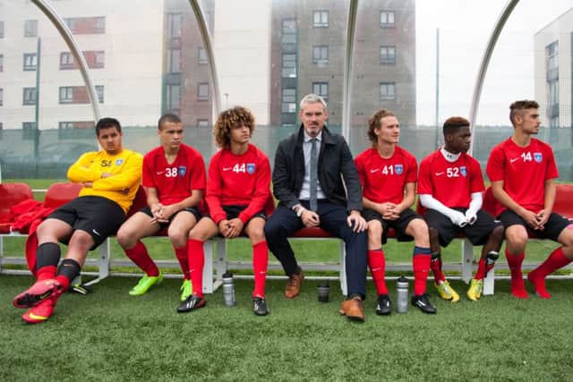 Former Motherwell player Chris Ewing with some of his charges during a coaching session at Spartans. Picture: Andrew OBrien
