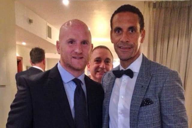 Maestro says 'Hi!': McStay popped up in the background of this picture of Hartson and Ferdinand. Picture: twitter.com/johnhartson10