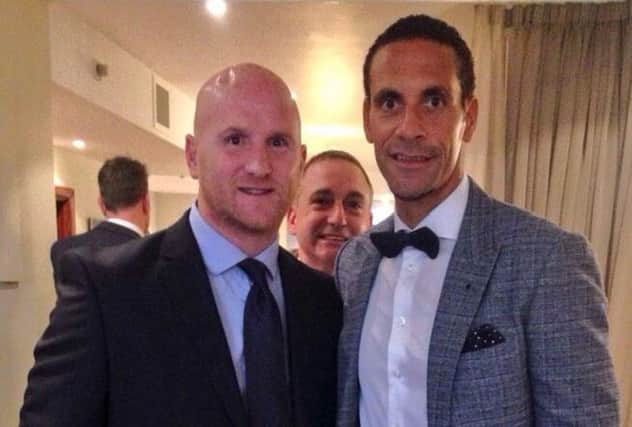 Maestro says 'Hi!': McStay popped up in the background of this picture of Hartson and Ferdinand. Picture: twitter.com/johnhartson10