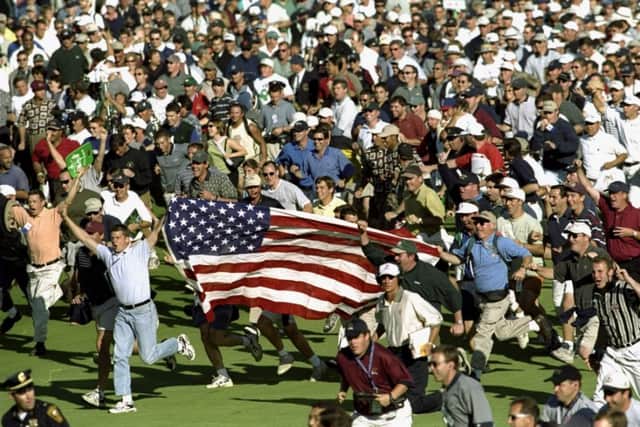 Fans celebrate during the infamous 33rd Ryder Cup match played at Brookline in Boston, Massachusetts in 1999. Picture: Getty