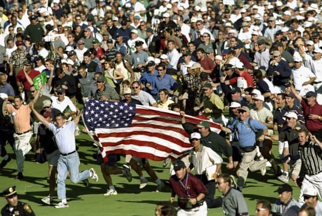 Fans celebrate during the infamous 33rd Ryder Cup match played at Brookline in Boston, Massachusetts in 1999. Picture: Getty