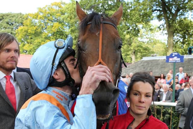 Daniel Tudhope embraces G Force after the pair won the Betfred Sprint Cup. Picture: Grossick Racing