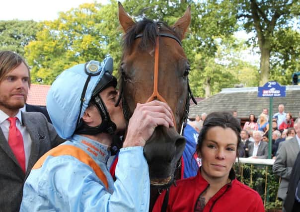 Daniel Tudhope embraces G Force after the pair won the Betfred Sprint Cup. Picture: Grossick Racing