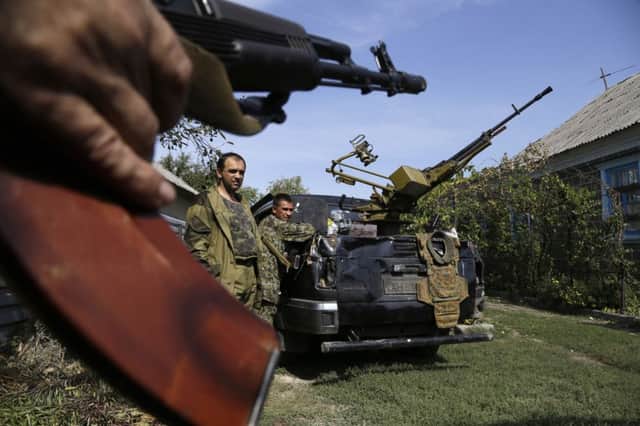 Heavily armed pro-Russian rebels await orders after fighting flared again. Picture: AP