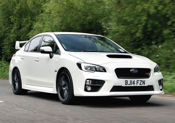 Subaru's latest WRX STI gets a new look, but it still can't be mistaken for anything else