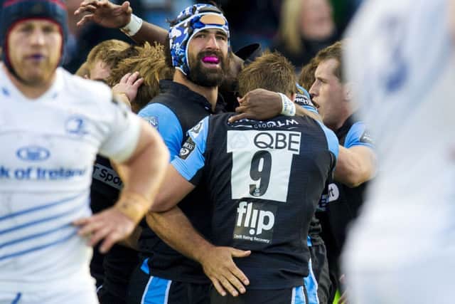 Glasgows Josh Strauss has the support of his team-mates during Sundays win over Leinster   Picture: SNS