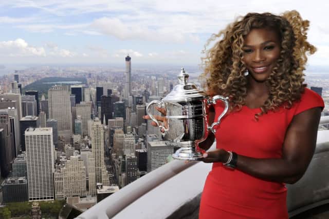 Serena Williams poses at the top of the Empire State building following her US Open victory over Denmarks Caroline WozniackiPicture:AP