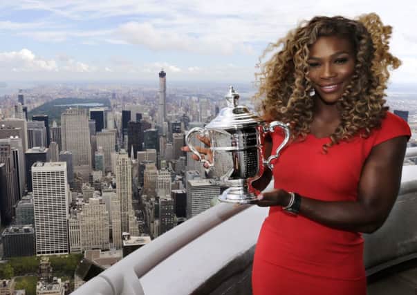 Serena Williams poses at the top of the Empire State building following her US Open victory over Denmarks Caroline WozniackiPicture:AP